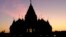The sun sets at the BAPS Swaminarayan Akshardham, the largest Hindu temple outside India in the modern era, Oct. 4, 2023, in Robbinsville, NJ.