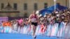 Kinzang Lhamo, of Bhutan, approaches the finish line at the end of the women's marathon competition at the 2024 Summer Olympics, in Paris, France, Aug. 11, 2024. 