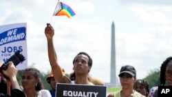 FILE - People listen to speakers during the 60th anniversary of the March on Washington at the Lincoln Memorial in Washington, Aug. 26, 2023.