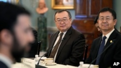 FILE - Chinese diplomat Liu Jianchao, center, during a meeting with Secretary of State Antony Blinken at the State Department in Washington, Jan. 12, 2024.