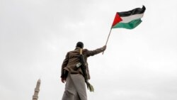 A Houthi supporter waves a Palestinian flag during a rally against the U.S.-led strikes against Yemen and in support of Palestinians in the Gaza Strip, in Sanaa, Yemen, April 26, 2024.