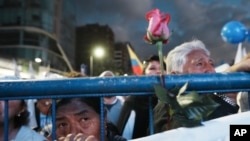 Supporters attend an open-air Mass during the closing campaign rally of the "Movement Construye" party in Quito, Aug. 17, 2023.