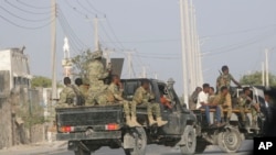 FILE: Security patrol the streets during fighting between al-Shabab extremists and soldiers in Mogadishu, Somalia, Tuesday, Feb. 21, 2023. Security forces in Somalia have ended a siege by al-Shabab extremists in the capital.