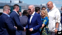 President Joe Biden, center, and first lady Jill Biden, second right, arrive on Air Force One at Harrisburg International Airport to attend a campaign rally in Harrisburg, Pennsylvania, July 7, 2024.