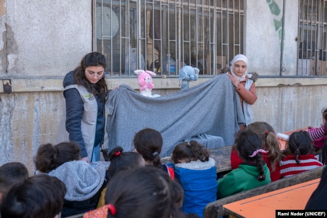 A UNICEF-supported child protection mobile team organized recreational activities for children in a shelter in Aleppo on Feb. 20, 2023, after a devastating earthquake had struck the city. (UNICEF)