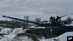 FILE: A Ukrainian tank is seen in position in the frontline in Bakhmut, Donetsk region, Ukraine, Feb. 12, 2023. 
