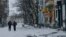 FILE: Local residents walk along a street in Bakhmut, Donetsk region, Ukraine, Feb. 12, 2023. 