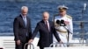 Russia's President Vladimir Putin, Defense Minister Andrei Belousov and Russian Navy Commander-in-Chief Admiral Alexander Moiseyev attend the annual Navy Day parade in Saint Petersburg, July 28, 2024. (Dmitri Lovetsky/Pool via Reuters)