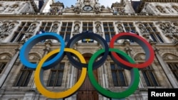 FILE - The Olympic rings are seen in front of the Hotel de Ville City Hall in Paris, France, March 14, 2023. 