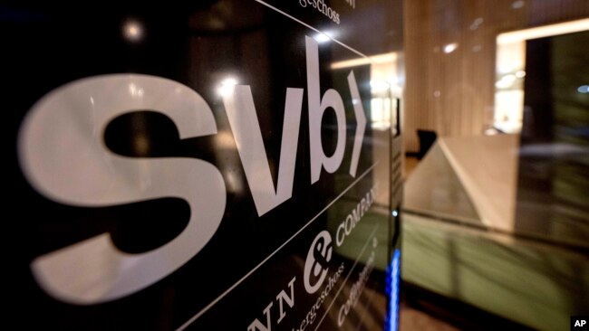 A sign of a branch of the Silicon Valley Bank is pictured at an office building where the bank is located in Frankfurt, Germany, March 12, 2023.