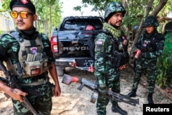 Soldiers from the Karen National Liberation Army (KNLA) prepare to patrol Myawaddy, the Thailand-Myanmar border town under the control of a coalition of rebel forces led by the Karen National Union, in Myanmar, April 15, 2024.
