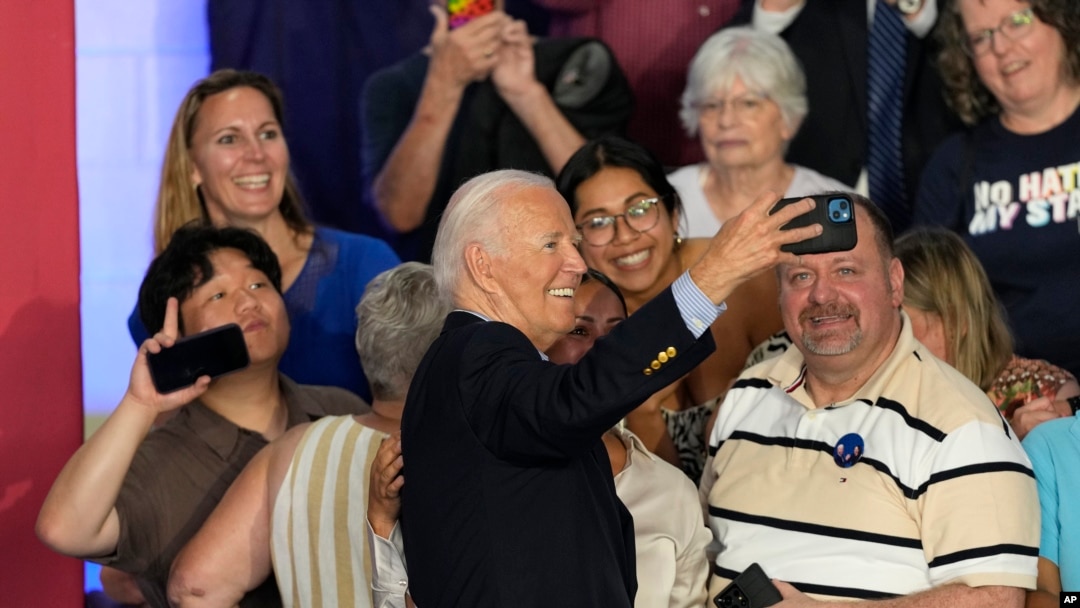 After speaking at a campaign rally at Sherman Middle School in Madison, Wisconsin, U.S. President Joe Biden takes a photo with supporters, July 5, 2024.