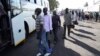 FILE - Freed prisoners join a queue to board a bus after being released from Harare Central Prison in Harare, Zimbabwe, May, 19, 2023. Zimbabwe released more than 4,000 prisoners under a presidential amnesty aimed at easing overcrowding in jails.