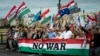 People march during a rally in support of Hungary's Prime Minister Viktor Orbán and his party in Budapest, Hungary, June 1, 2024. Orbán with 14 years in power is the European Union's longest serving leader. 