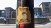 A wanted sign featuring an image of Daniel Abed Khalife, a former soldier who is suspected of terrorism offenses, is displayed near Wandsworth prison, from which he escaped, in London, Sept. 7, 2023.