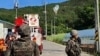 FILE - In this photo provided by Jeonbuk Fire Headquarters, balloons with trash presumably sent by North Korea hang on electric wires as South Korean army soldiers stand guard in Muju, South Korea, May 29, 2024.