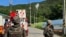 FILE - In this photo provided by Jeonbuk Fire Headquarters, balloons with trash presumably sent by North Korea hang on electric wires as South Korean army soldiers stand guard in Muju, South Korea, May 29, 2024.