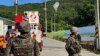 FILE - In this photo provided by Jeonbuk Fire Headquarters, balloons with trash presumably sent by North Korea hang on electric wires as South Korean army soldiers stand guard in Muju, South Korea, May 29, 2024.