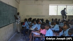 Students attend a math class at the Jean Marie Vincent High School in Port-au-Prince, Haiti, on Thursday, July 25, 2024. (AP Photo/Odelyn Joseph)