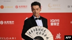  资料照：中国影视明星胡歌现身北京国际电影节开幕式。（2024年4月18日）