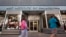 FILE - People walk past the Art Institute of Philadelphia operated by the Education Management Corporation on Nov. 16, 2015, in Philadelphia.