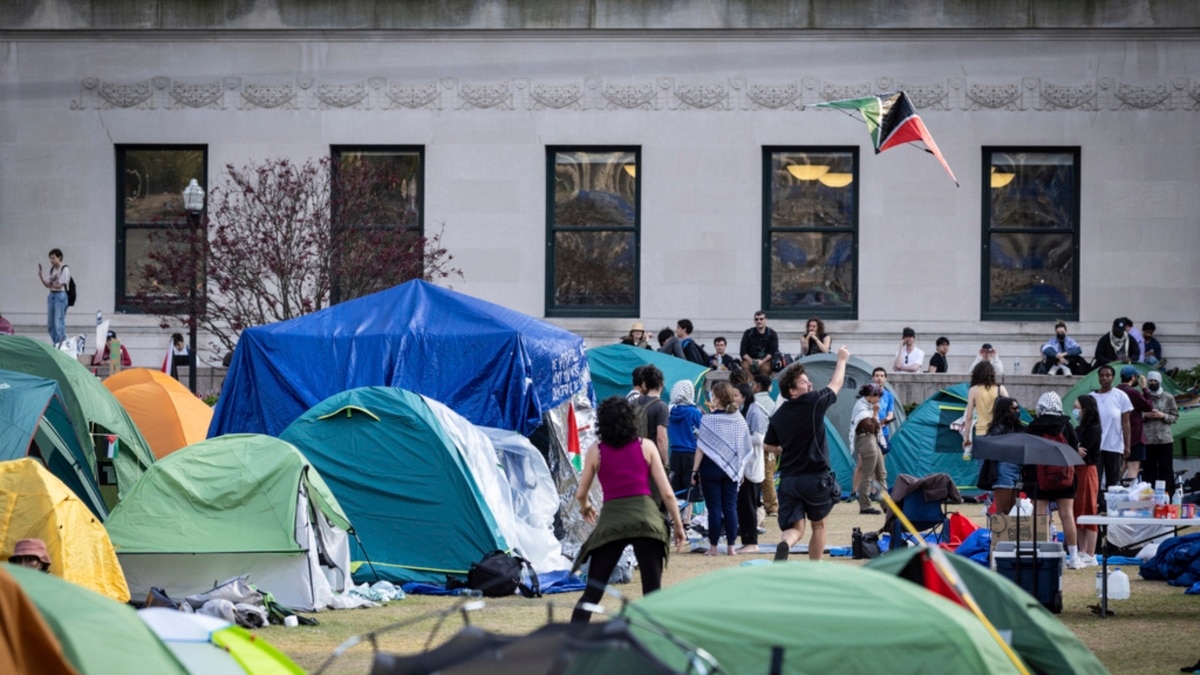 Protesters show up at the campus camp set up for the television broadcast