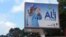 FILE - A defaced billboard of Gabon's ousted president, Ali Bongo, is seen on a street in Libreville, Gabon, Aug. 30, 2023. 