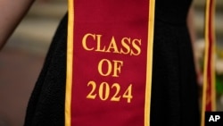 A recent graduate wears a garment with their graduation year on the University of Southern California campus April 25, 2024, in Los Angeles. 