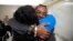Valerie Laveus greets her brother Reginald Malherbe Daniel as he arrives from Haiti in Fort Lauderdale, Florida, on Aug. 9, 2023. Under a humanitarian parole program, up to 30,000 people are allowed each month to enter the U.S. from Cuba, Haiti, Nicaragua and Venezuela