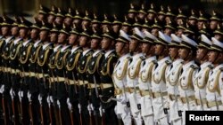 Honor guard members stand during a welcome ceremony for President of Equatorial Guinea Teodoro Obiang Nguema Mbasogo at the Great Hall of the People in Beijing, China.