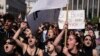 University students chant slogans during a protest as they head to the headquarters of private operator Hellenic Train, in Athens, March 3, 2023. 