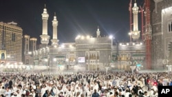 Pilgrims leave after offering prayers outside at the Grand Mosque during the annual Hajj pilgrimage in Mecca, Saudi Arabia, June 14, 2024.