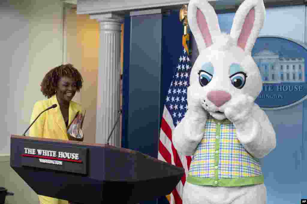 White House press secretary Karine Jean-Pierre arrives as the Easter Bunny stands at the podium before a briefing at the White House in Washington. (AP Photo/Mark Schiefelbein)