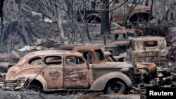 FILE - Vintage vehicles burned in the Park Fire are seen near Chico, California, July 26, 2024.