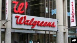 FILE - The entrance to a Walgreens is seen on Oct. 14, 2022, in Boston.