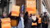 FILE - Junior doctors picket in London, March 14, 2023. Unions representing nurses, ambulance crews and other health care workers in England reached a deal March 16, 2023, to resolve strikes for higher wages, though the pact didn't include doctors.