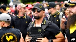 FILE - Then-Proud Boys chairman Enrique Tarrio rallies in Portland, Ore. Tarrio, who identifies as an Afro-Cuban, is an illustration of how the extremist fringes today boast support from virtually every corner of the American melting pot. 