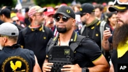 FILE - Then-Proud Boys chairman Enrique Tarrio rallies in Portland, Oregon, Aug. 17, 2019.