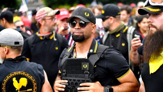 FILE - Then-Proud Boys chairman Enrique Tarrio rallies in Portland, Ore., Aug. 17, 2019. Tarrio, who identifies as an Afro-Cuban, is an illustration of how the extremist fringes today boast support from virtually every corner of the American melting pot.