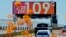 FILE - A digital billboard displays an unofficial temperature on July 17, 2023, in downtown Phoenix. 