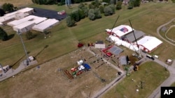 FILE - The Butler Farm Show, site of a rally for Republican Donald Trump, is seen July 15, 2024, in Butler, Pa. Trump was wounded July 13 at the rally; a shooter reportedly was atop the building farthest to the right in the cluster of buildings at left.