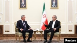 Iran's President Masoud Pezeshkian, right, meets with Russian Security Council's Secretary Sergei Shoigu in Tehran, Iran, Aug. 5, 2024. (Iran's Presidency/WANA/Handout via Reuters)
