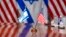 Israeli and U.S. flags are reflected on a conference table where Defense Secretary Lloyd Austin met with Israeli Defense Minister Yoav Gallant, at the Pentagon, March 26, 2024, in Washington.