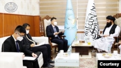 Wang Yu, Chinese ambassador to Afghanistan, meets with the Taliban's minister of higher education, Nida Mohammad Nadem, in Kabul on May 22, 2023. (Photo courtesty Afghanistan Ministry of Higher Education)