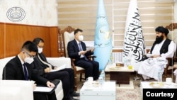 Wang Yu, Chinese ambassador to Afghanistan, meets with the Taliban's minister of higher education, Nida Mohammad Nadem, in Kabul on May 22, 2023. (Photo via Afghanistan Ministry of Higher Education)