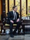 In this photo released by Xinhua News Agency, visiting Tesla founder and CEO Elon Musk, left, meets with Chinese Premier Li Qiang in Beijing, April 28, 2024. (Wang Ye/Xinhua via AP)