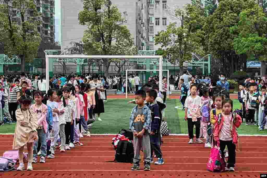 Students evacuate to the playground at a school in Xiamen, in eastern China's Fujian province, April 3, 2024, after a major earthquake hit Taiwan's east.