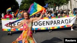 FILE - People attend a march to celebrate LGBTQ+ rights at the annual pride parade in Vienna, Austria, June 17, 2023. 