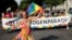 FILE - People attend a march to celebrate LGBTQ+ rights at the annual pride parade in Vienna, Austria, June 17, 2023. 