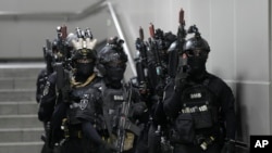 South Korean soldiers get ready to start in an anti-terror drill as a part of the Ulchi Freedom Shield military exercise between the U.S. and South Korea at a subway station in Seoul, South Korea, Aug. 22, 2023.